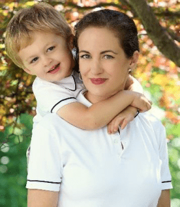 A woman and child are posing for the camera.