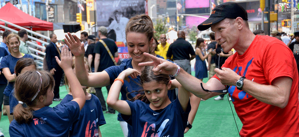 A woman and girl are playing with each other.